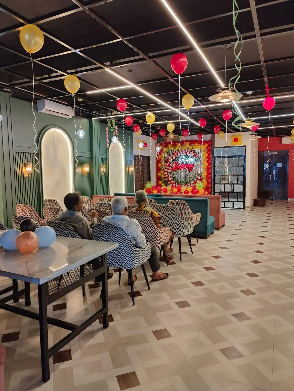 Families dining at Kasoota Café & Bistro during a birthday event, Ayodhya