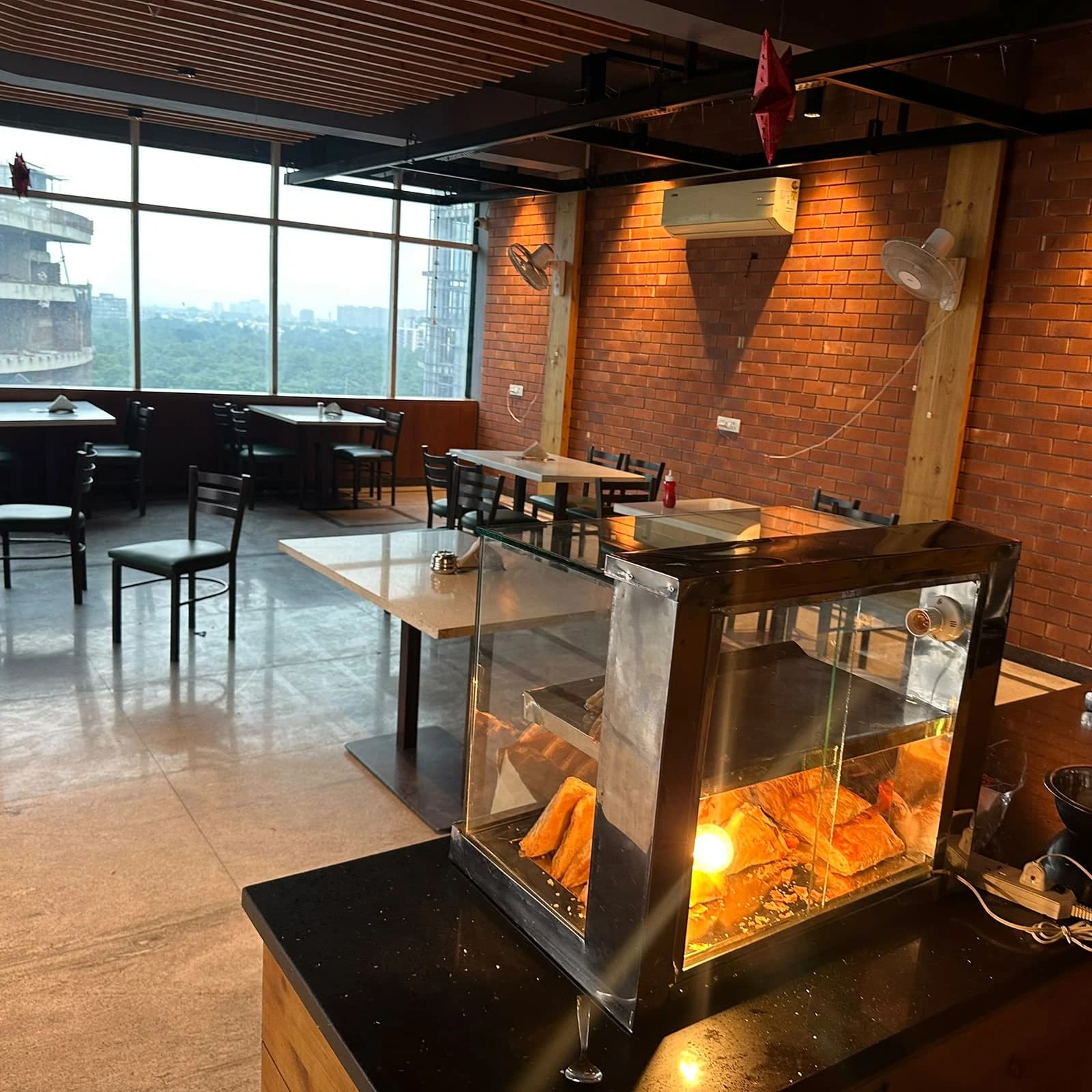 Twilight Tandoor's dining area with a view over Kharar, Punjab
